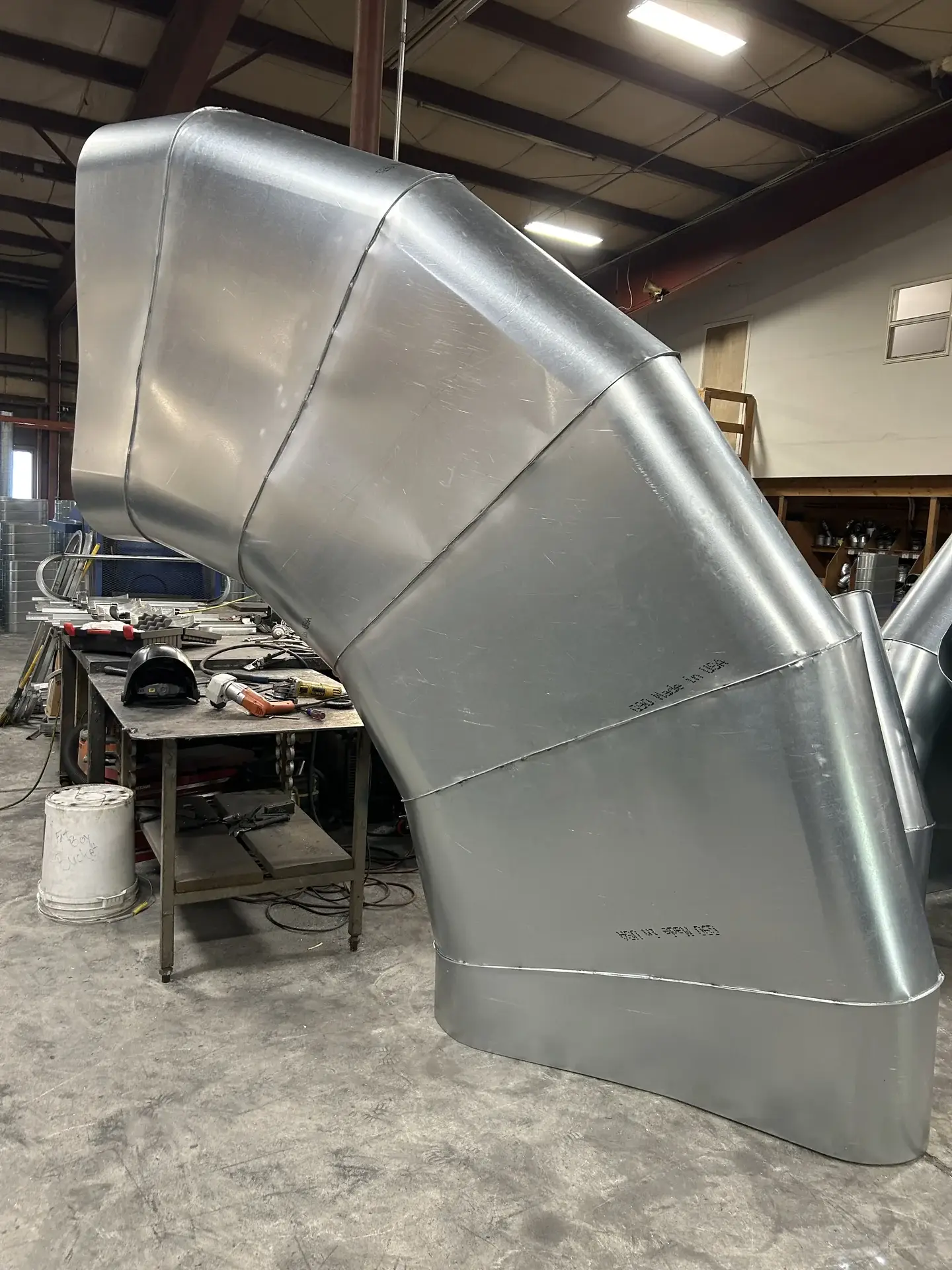 Large fabricated flat oval duct elbow in the shop