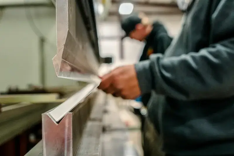 Sheet metal being formed in a press brake