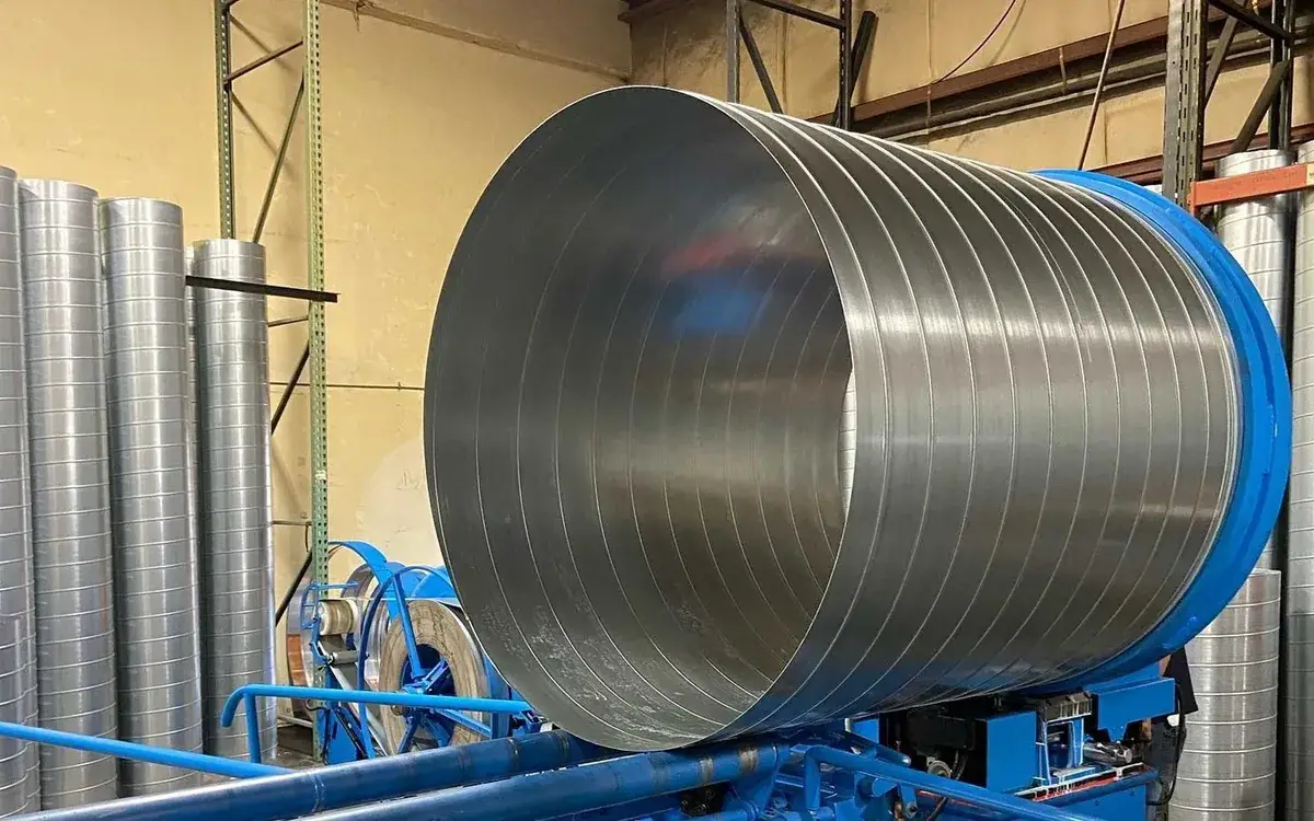 Large spiral sheet metal duct on fabrication equipment